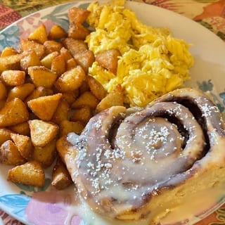 2 Eggs with Cinnamon Roll & Home Fries